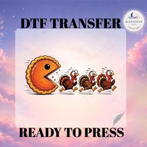 May include: A DTF transfer ready to press featuring a cartoon pumpkin pie slice chasing three turkeys. The text DTF TRANSFER and READY TO PRESS is displayed. A circular logo with a crescent moon and the text BLUEHAVEN DTF is in the corner.