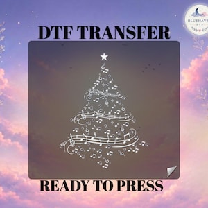 May include: A DTF transfer sheet featuring a white graphic of a Christmas tree composed of musical notes and staves. The text DTF TRANSFER appears at the top and READY TO PRESS at the bottom. A circular logo with a moon and text is in the corner.