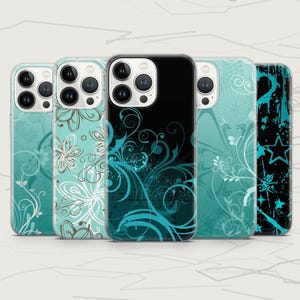 May include: Five smartphone cases arranged in a row, each featuring a distinct design. The cases display various patterns including teal and white floral swirls, intricate black and teal filigree, and a black background with teal stars.