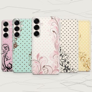 May include: Five smartphone cases arranged in a row, each featuring a vertical camera cutout on the left. The cases display various pastel colors including pink, mint green, white, cream, and yellow, all decorated with polka dots and floral swirls.