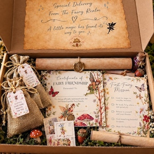 May include: A cardboard gift box containing a scroll with a wax seal, a Certificate of Fairy Friendship, a First Fairy Mission card, and two gold-toned burlap drawstring pouches with tags reading A little something magical for you.