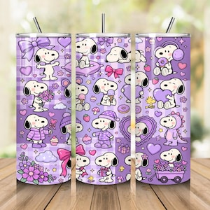 May include: A cylindrical stainless steel tumbler with a straw, featuring a repeating pattern of Snoopy in various poses against a purple plaid background. The design includes Snoopy with flowers, hearts, bows, cupcakes, and wearing pajamas.