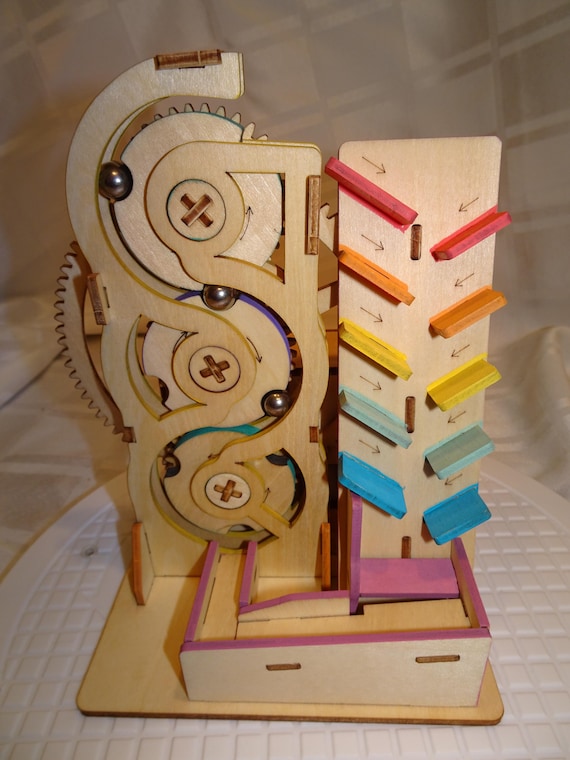 A fully assembled, motorised wooden marble run that just *runs* — hypnotic mechanical loops delivered ready to mesmerize, no build frustration required.