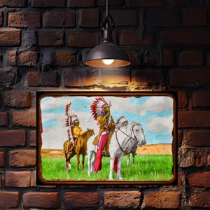 May include: A framed print depicting Native American figures on horseback. The image shows two figures on horseback, one on a white horse and the other on a brown horse, in a grassy field. The figures are wearing traditional headdresses and clothing.