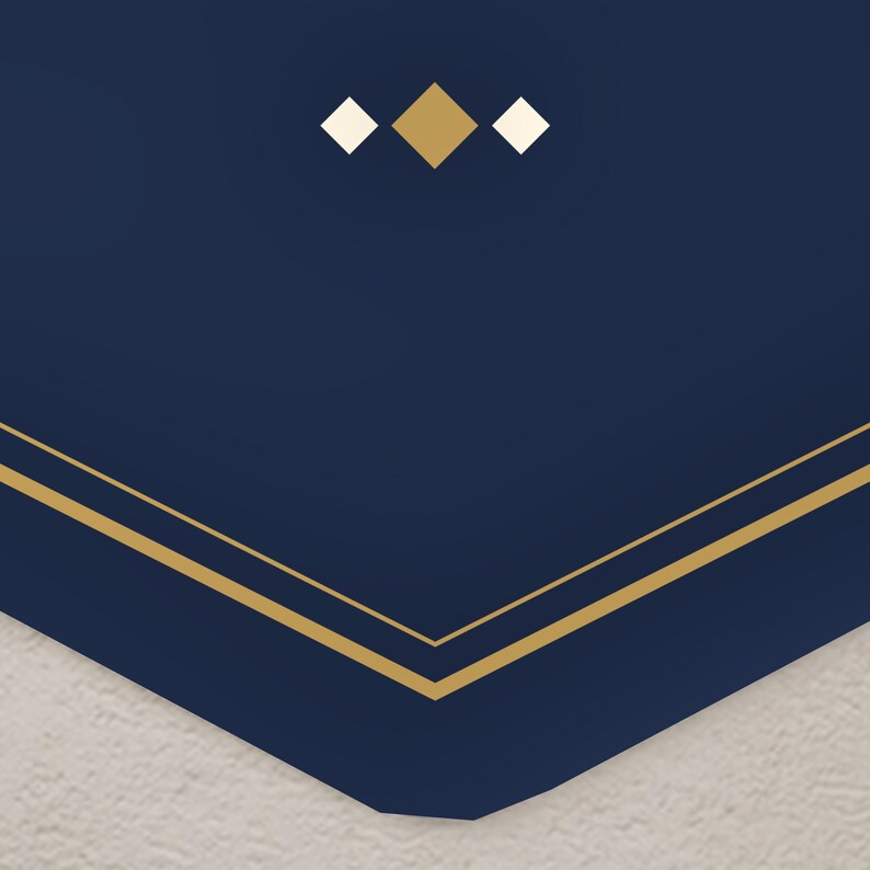 May include: A dark navy blue surface featuring a geometric design with two thin gold lines forming a V-shape at the bottom. Above the lines, there is a centered arrangement of three small diamonds, with a larger gold diamond flanked by two smaller white diamonds.