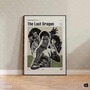 May include: A framed movie poster for The Last Dragon, featuring a black and white illustration of the main character in a martial arts pose, surrounded by other cast members. The text includes the title, the year 1985, and production credits.