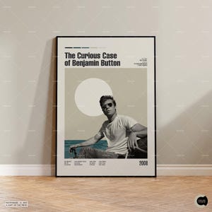 May include: A vertical movie poster for The Curious Case of Benjamin Button featuring a black and white photograph of a person wearing sunglasses and a t-shirt. The design includes a large white circle, a blue horizon line, and the year 2008.
