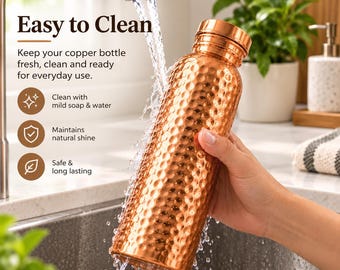 May include: A cylindrical copper water bottle with a hammered texture and a smooth metallic cap. The bottle is being rinsed under a kitchen tap, with water cascading over its surface. Text on the image reads Easy to Clean, Clean with mild soap & water, Maintains natural shine, and Safe & long lasting.