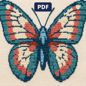 A finished a butterfly cross stitch piece, stitched and framed on a wall
