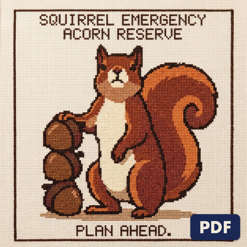 A finished squirrel acorn reserve cross stitch piece, stitched and framed on a wall