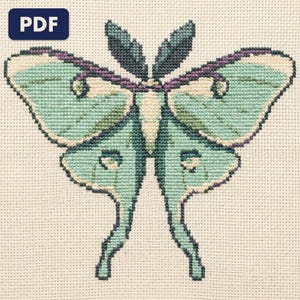 A chart from the Woodland and Cottagecore bundle shown worked and framed
