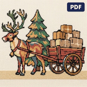 A finished a reindeer hauling parcels cross stitch piece, stitched and framed on a wall