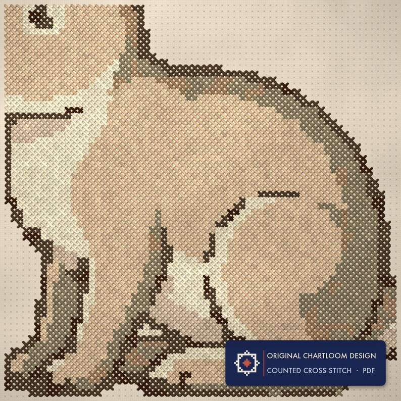 Close up of the a rabbit cross stitch design worked stitch by stitch, every cross and thread colour visible