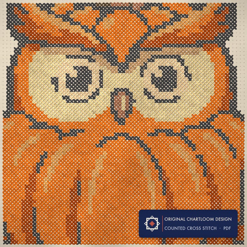 Close up of the owl cross stitch design worked stitch by stitch, every cross and thread colour visible