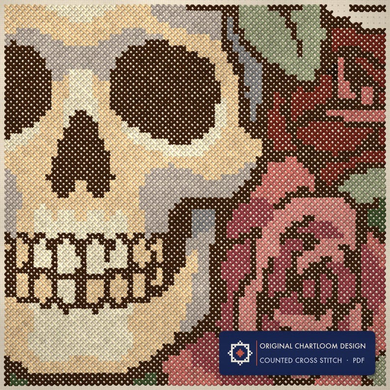 Close up of the skull wreathed in roses cross stitch design worked stitch by stitch, every cross and thread colour visible