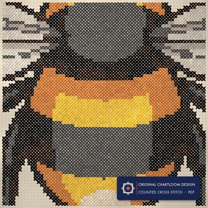 Close up of the a bumblebee cross stitch design worked stitch by stitch, every cross and thread colour visible