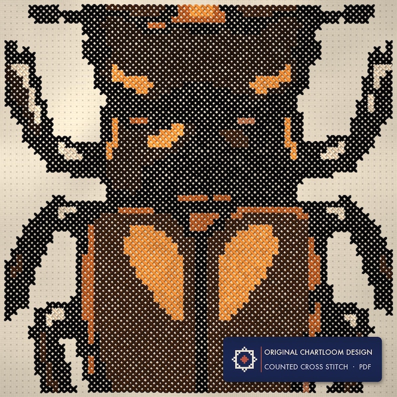 Close up of the stag beetle cross stitch design worked stitch by stitch, every cross and thread colour visible