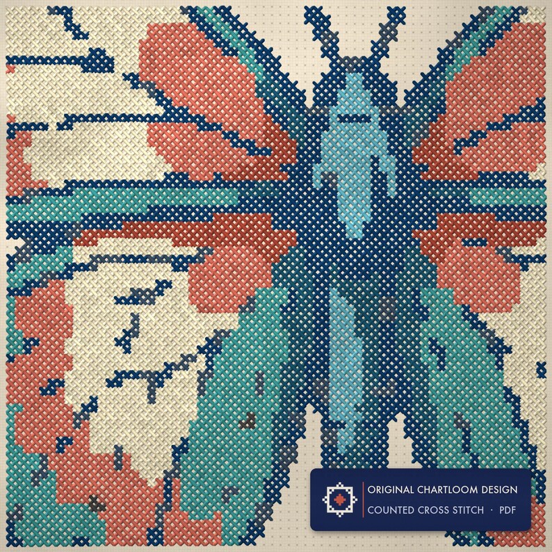 Close up of the a butterfly cross stitch design worked stitch by stitch, every cross and thread colour visible