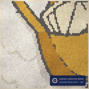 Close up of the a goose postman cross stitch design worked stitch by stitch, every cross and thread colour visible
