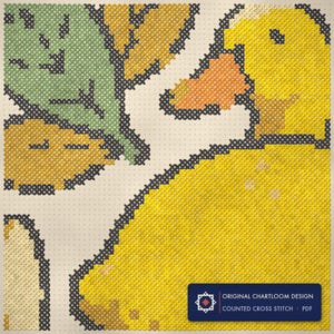 Close up of the duck cross stitch design worked stitch by stitch, every cross and thread colour visible
