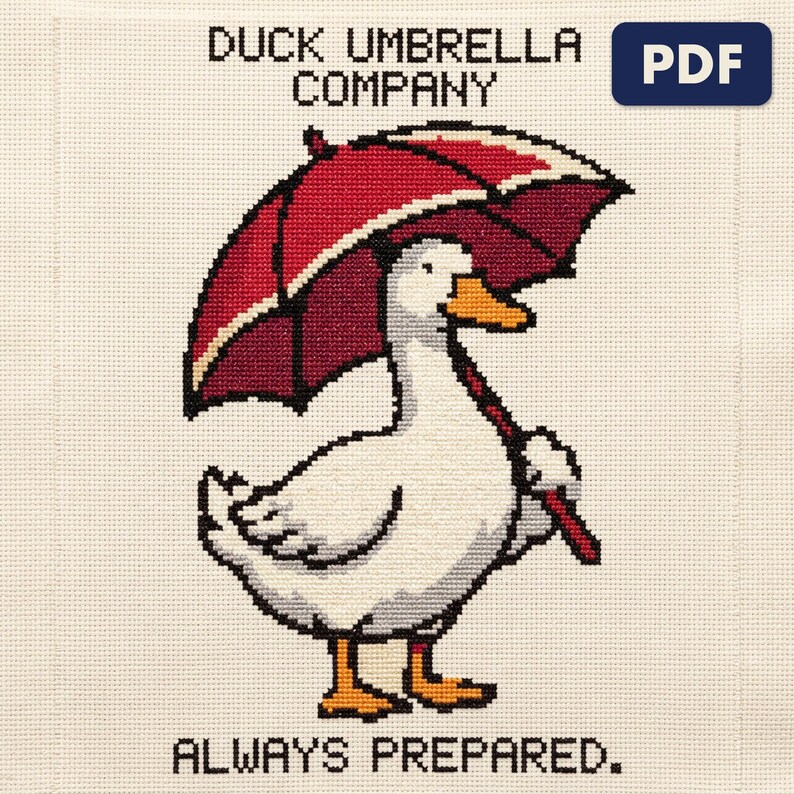 A finished duck umbrella company cross stitch piece, stitched and framed on a wall