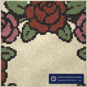 Close up of the rose wreath with crossed bones cross stitch design worked stitch by stitch, every cross and thread colour visible
