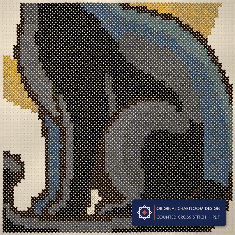 Close up of the black cat under a crescent moon cross stitch design worked stitch by stitch, every cross and thread colour visible