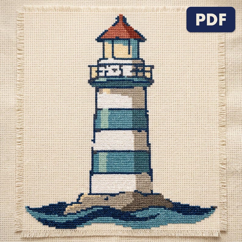 A finished a lighthouse cross stitch piece, stitched and framed on a wall