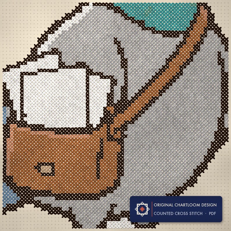 Close up of the pigeon message center cross stitch design worked stitch by stitch, every cross and thread colour visible