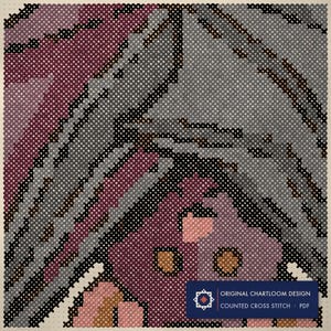 Close up of the hanging bat cross stitch design worked stitch by stitch, every cross and thread colour visible