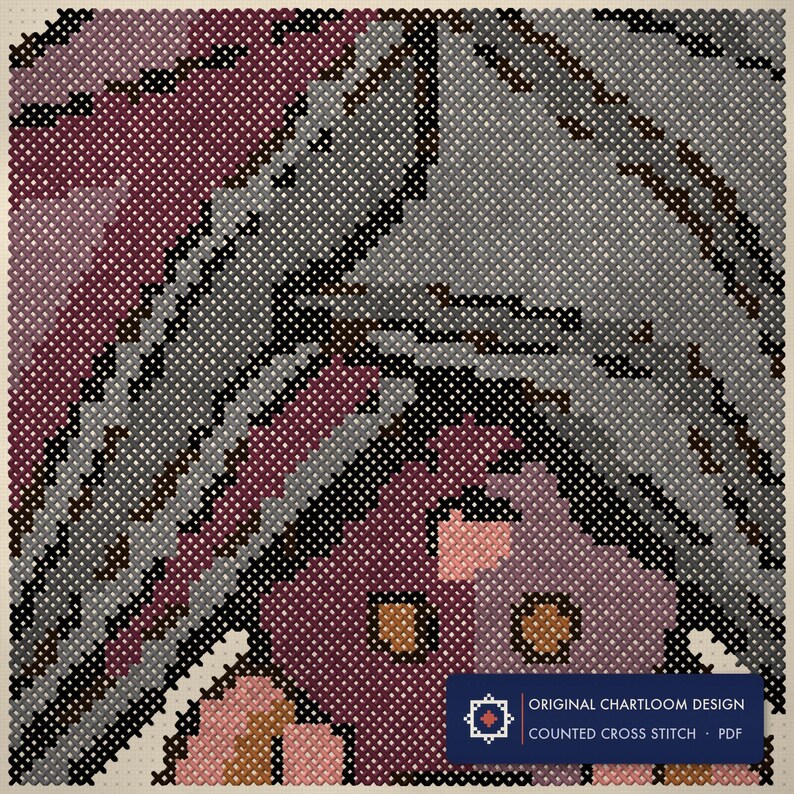 Close up of the hanging bat cross stitch design worked stitch by stitch, every cross and thread colour visible
