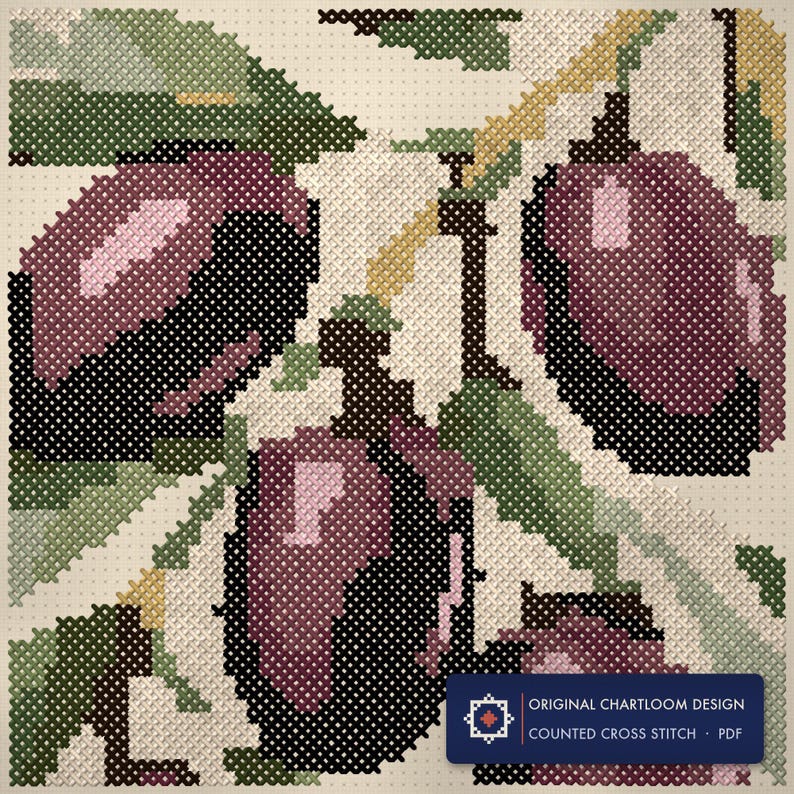 Close up of the an olive branch cross stitch design worked stitch by stitch, every cross and thread colour visible