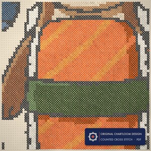 Close up of the otter cross stitch design worked stitch by stitch, every cross and thread colour visible