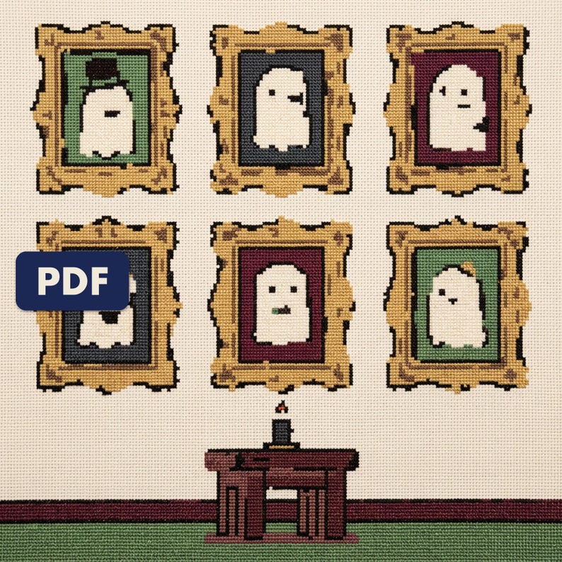 A finished a gallery of ghost portraits cross stitch piece, stitched and framed on a wall