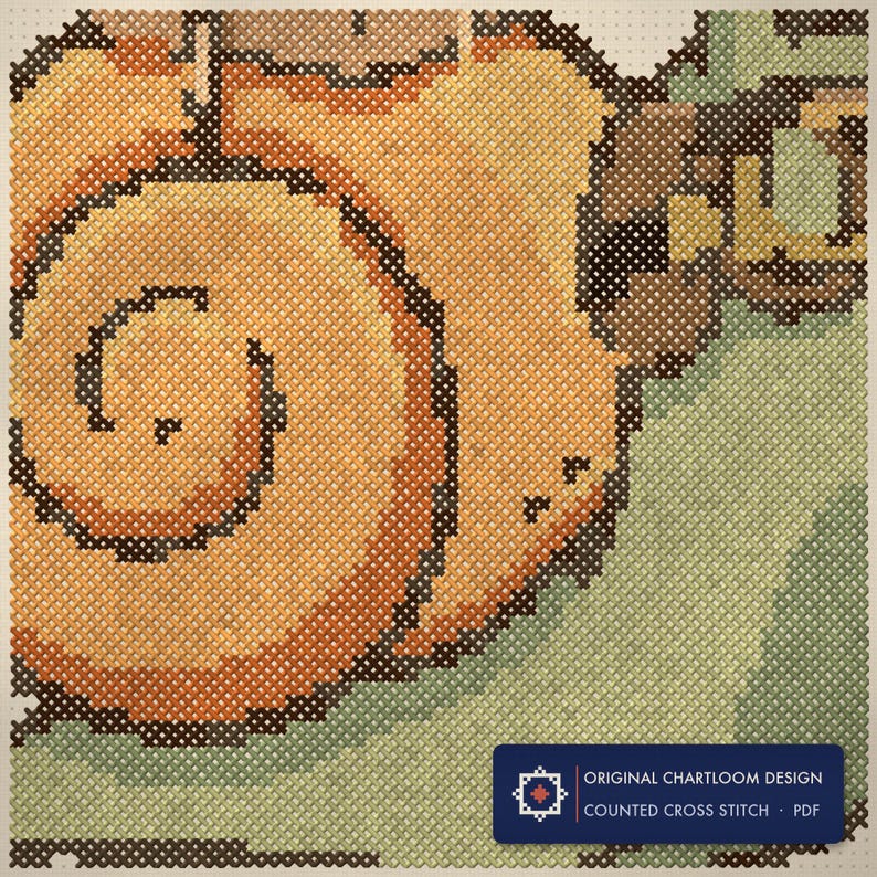 Close up of the snail express cross stitch design worked stitch by stitch, every cross and thread colour visible