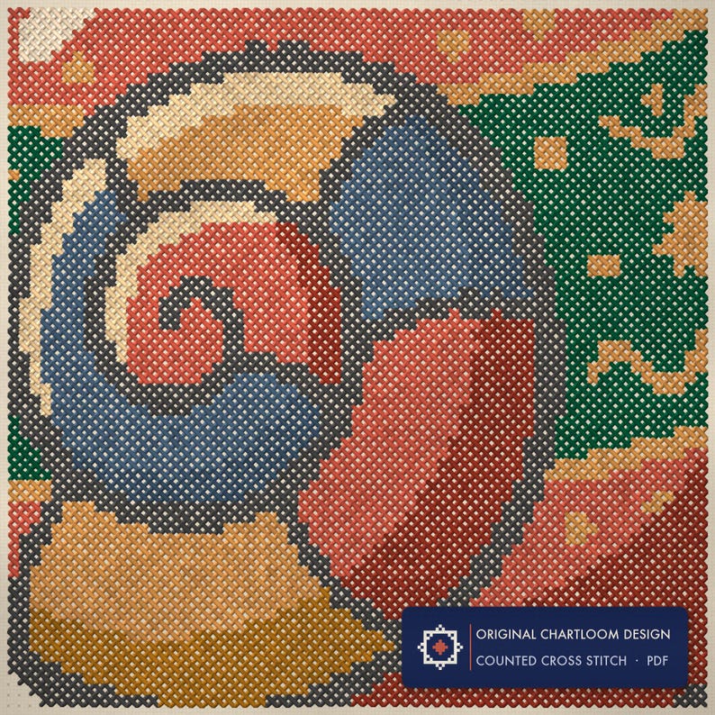 Close up of the a snail whose shell is a bauble cross stitch design worked stitch by stitch, every cross and thread colour visible