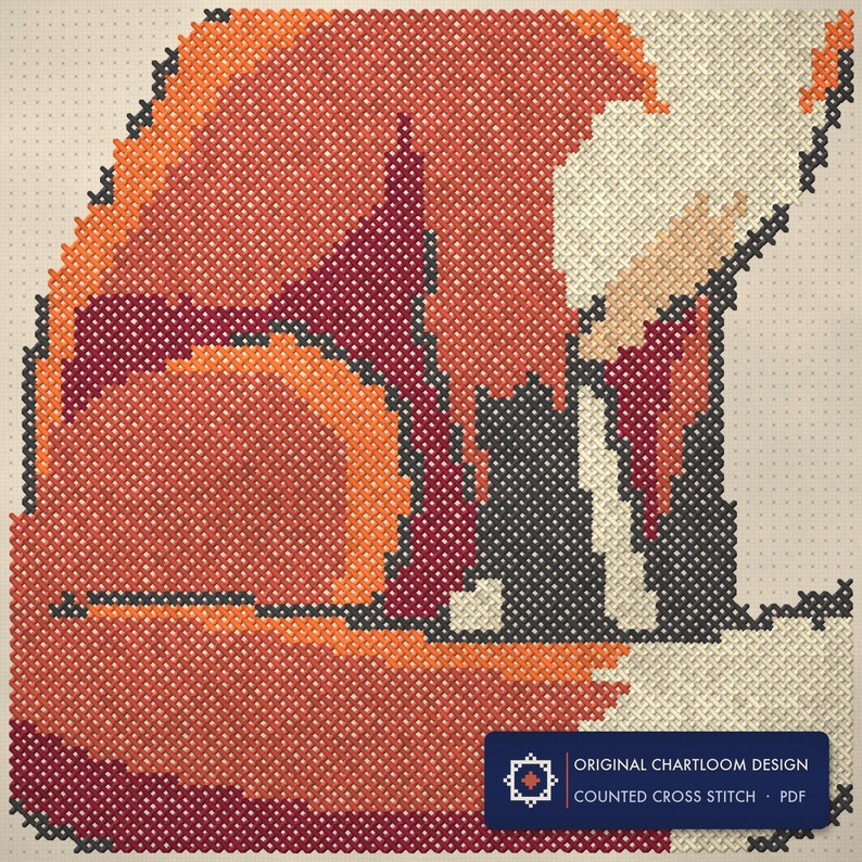 Close up of the a red fox cross stitch design worked stitch by stitch, every cross and thread colour visible