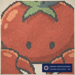 Close up of the crab cross stitch design worked stitch by stitch, every cross and thread colour visible