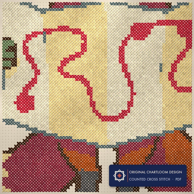 Close up of the fox lost map company cross stitch design worked stitch by stitch, every cross and thread colour visible