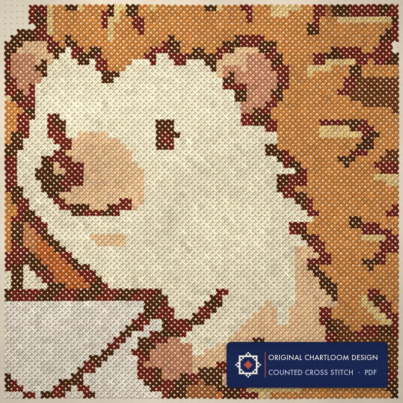 Close up of the hedgehog postal service cross stitch design worked stitch by stitch, every cross and thread colour visible