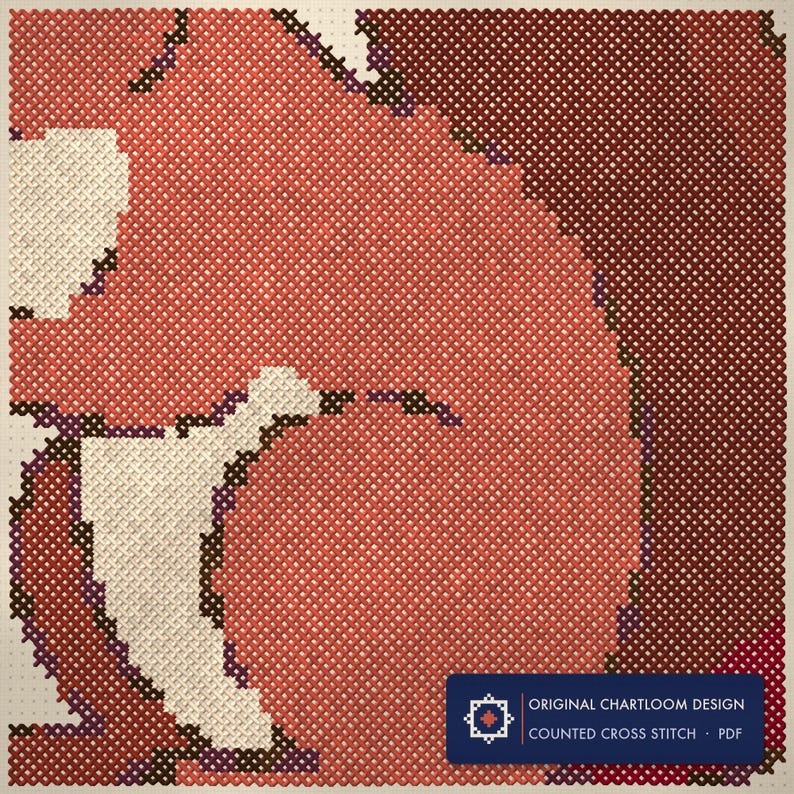 Close up of the a red squirrel cross stitch design worked stitch by stitch, every cross and thread colour visible