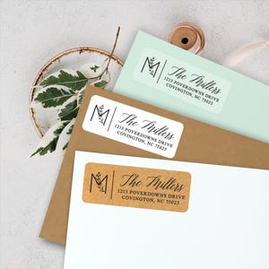 May include: Three return address labels with a brown, white, and light green background. Each label features a black initial "M" with a leafy design and the text "The Millers" in black cursive font. The address is printed below the name in black font. The address is 1213 POVERDOWNS DRIVE COVINGTON, NC 75023.