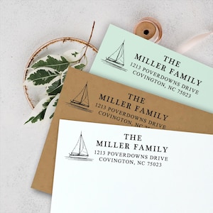 May include: Three different versions of a return address stamp featuring a sailboat graphic and the text "THE MILLER FAMILY 1213 POVERDOWNS DRIVE COVINGTON, NC 75023". The stamps are printed on white, light green, and brown paper.