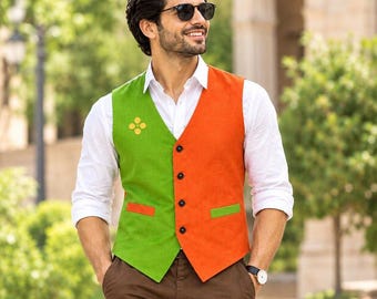 May include: A white long-sleeved button-down shirt worn under a colour-blocked waistcoat featuring a bright green left side and a vibrant orange right side. The waistcoat has four black buttons, two small welt pockets, and a yellow four-dot floral emblem.