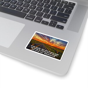 May include: A rectangular sticker featuring a sunset landscape over a road with side mirrors visible. The text reads: To the teacher that said I'd never make any money by staring out the window: Look at me now! #BusDriverLife. The sticker is on a laptop.