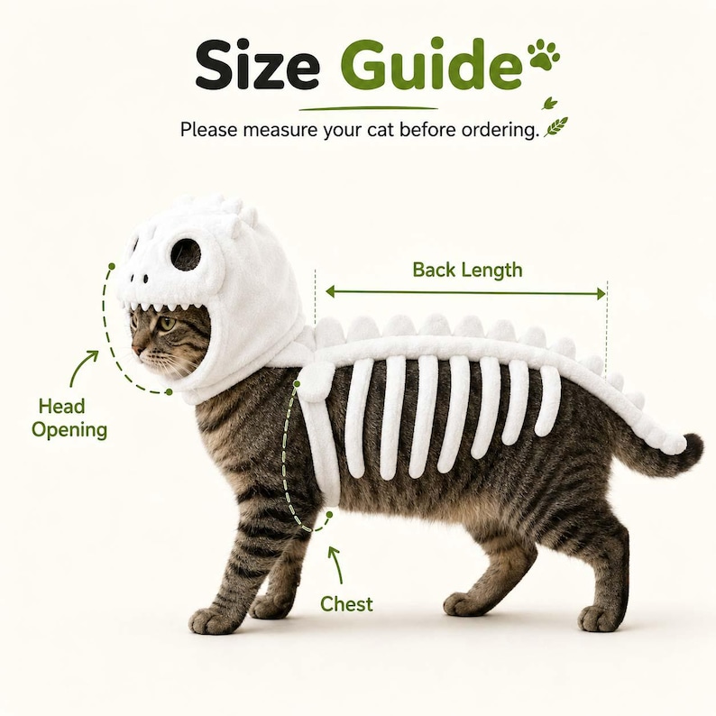 Puede incluir: Un disfraz de esqueleto de dinosaurio blanco para gato, con una capucha con dise&ntilde;o de calavera y una columna vertebral con aletas dorsales. La imagen incluye el texto Size Guide, Please measure your cat before ordering, Head Opening.