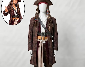 May include: A pirate costume featuring a brown distressed coat, white shirt, burgundy vest, and brown trousers. Includes a brown tricorn hat with a red bandana, long brown dreadlocks with colorful beads, a black shoulder strap, and two belts with buckles.