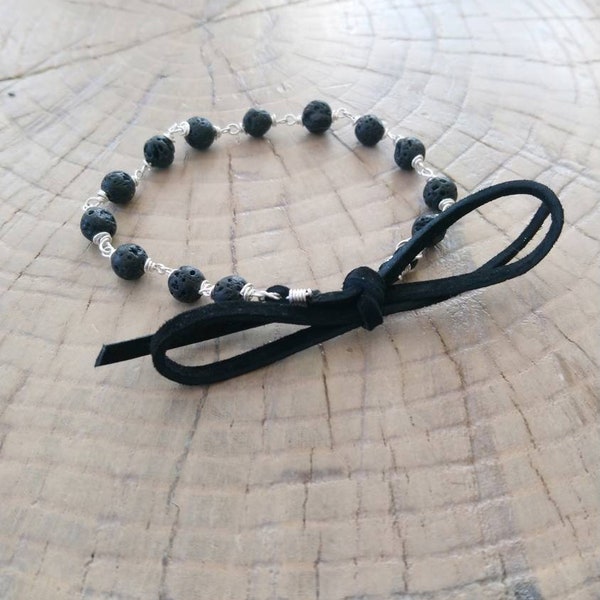 Bracelet... "Essence" sterling silver wire wrapped bracelet with black lava beads.