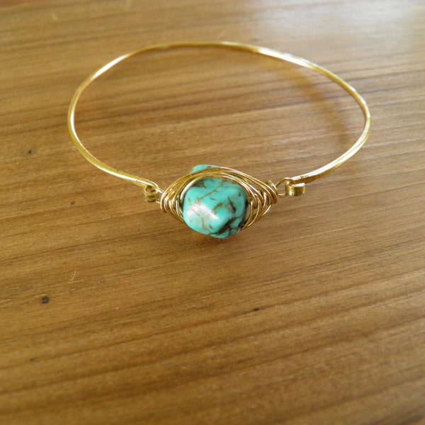 Bracelet... Bangle Bracelet hammered brass with a wire wrapped turquoise stone.