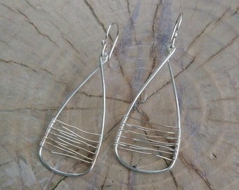 Earrings... "Eye Catchers" handmade and hammered sterling silver earrings.